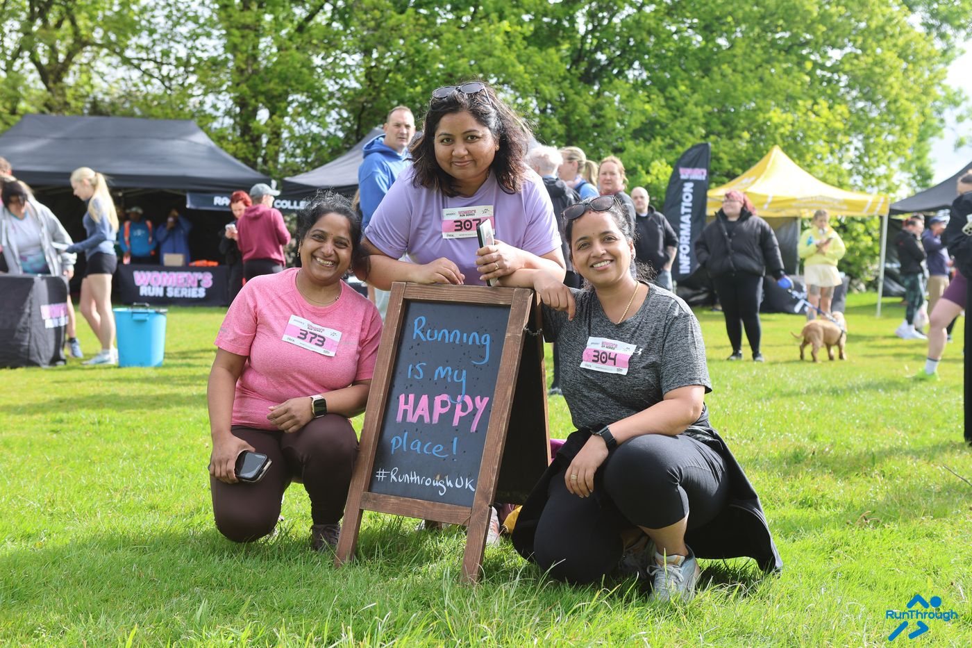 Friends holding an I ran my first race sign at Heaton Park
